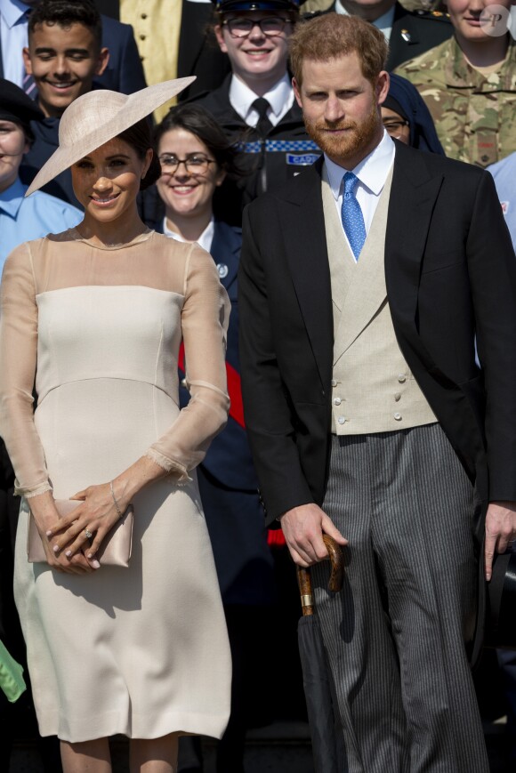 Meghan Markle, duchesse de Sussex, avec le prince Harry lors d'une garden party en l'honneur du prince Charles au palais de Buckingham à Londres le 22 mai 2018, trois jours après leur mariage.