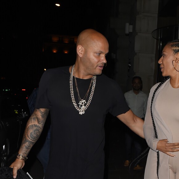 Melanie Brown (Mel B) et son mari Stephen Belafonte sortent du restaurant "Novikov", situé dans le quartier de Mayfair à Londres, le 12 mai 2016.