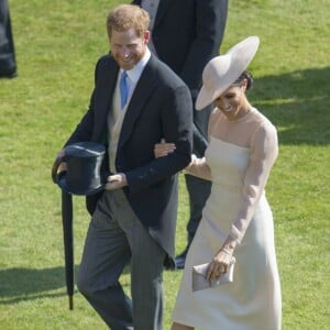 Le prince Harry et la duchesse Meghan de Sussex (Meghan Markle) le 22 mai 2018 au palais de Buckingham lors d'une garden party en l'honneur des patronages du prince Charles à quelques mois de son 70e anniversaire.