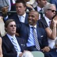 Thierry Henry et sa compagne enceinte Andrea Rajacic lors des demi-finales hommes du tournoi de Wimbledon au All England Lawn Tennis and Croquet Club, à Londres le 10 juillet 2015