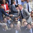 Thierry Henry et sa compagne enceinte Andrea Rajacic avec Boris Becker lors des demi-finales hommes du tournoi de Wimbledon au All England Lawn Tennis and Croquet Club, à Londres le 10 juillet 2015