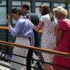 La duchesse Catherine de Cambridge (Kate Middleton) et la duchesse Meghan de Sussex (Meghan Markle) arrivant à Wimbledon le 14 juillet 2018, quelques dizaines de minutes avant le début de la finale dames opposant Serena Williams et Angelique Kerber.