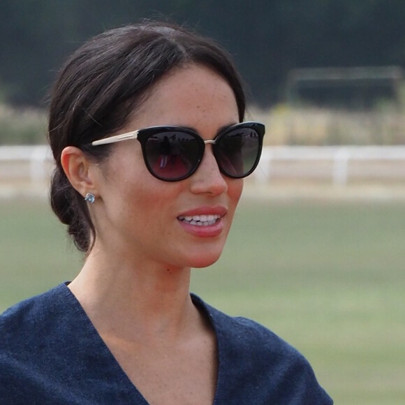 Le prince Harry, duc de Sussex et Meghan Markle, la Duchesse de Sussex arrivent à la Royal Berkshire Polo Cup où le Duc participe aujourd'hui à la Coupe ISP Hanz de Sentebale à Windsor au Royaume-Uni, le 26 juillet 2018.