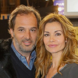 Ingrid Chauvin et son mari Thierry Peythieu au salon du livre à la porte de Versailles à Paris le 22 mars 2015.