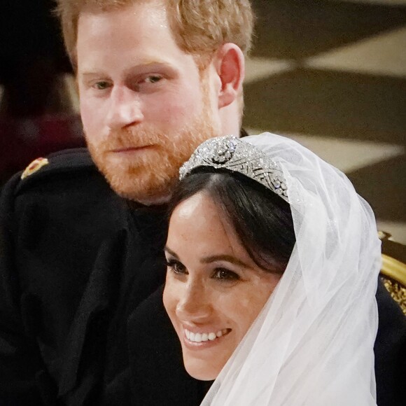 Meghan Markle, duchesse de Sussex, dans sa robe de mariée Givenchy réalisée par Clare Waight Keller, et le prince Harry lors de leur mariage à Windsor le 19 mai 2018.