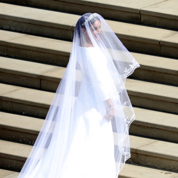 Meghan Markle, duchesse de Sussex, dans sa robe de mariée Givenchy réalisée par Clare Waight Keller, et le prince Harry lors de leur mariage à Windsor le 19 mai 2018.