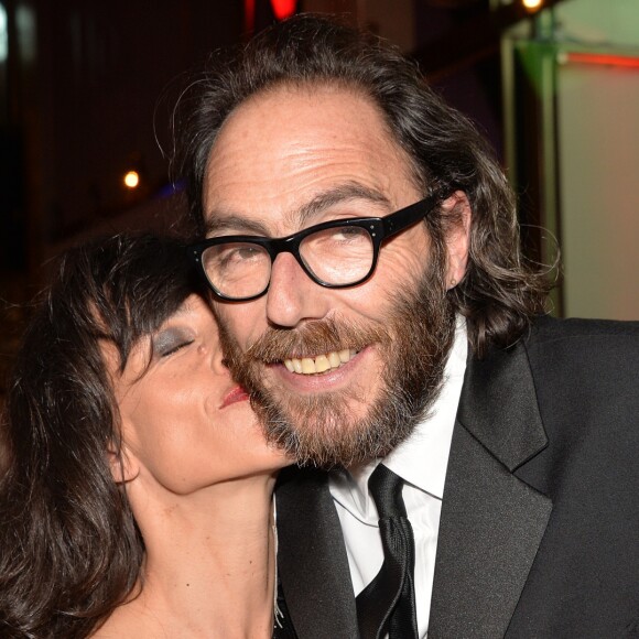 Romane Bohringer et son compagnon Philippe Rebbot - Personnalités lors de la 10ème cérémonie des Globes de Cristal au Lido à Paris, le 13 avril 2015.