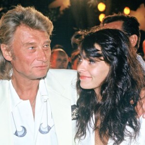 Johnny Hallyday et Adeline Blondieau à Saint-Tropez, le 27 juillet 1991.