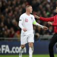 A pitch invader runs to England's Wayne Rooney during the International Friendly at Wembley Stadium, London. ... England v USA - International Friendly - Wembley Stadium ... 15-11-2018 ... London ... UK ... Photo credit should read: Nick Potts/PA Wire. Unique Reference No. 39723836 ... Picture date: Thursday November 15, 2018. See PA story SOCCER England. Photo credit should read: Nick Potts/PA Wire. RESTRICTIONS: Use subject to FA restrictions. Editorial use only. Commercial use only with prior written consent of the FA. No editing except cropping.15/11/2018 - 