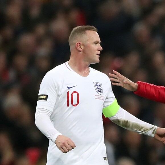 A pitch invader runs to England's Wayne Rooney during the International Friendly at Wembley Stadium, London. ... England v USA - International Friendly - Wembley Stadium ... 15-11-2018 ... London ... UK ... Photo credit should read: Nick Potts/PA Wire. Unique Reference No. 39723836 ... Picture date: Thursday November 15, 2018. See PA story SOCCER England. Photo credit should read: Nick Potts/PA Wire. RESTRICTIONS: Use subject to FA restrictions. Editorial use only. Commercial use only with prior written consent of the FA. No editing except cropping.15/11/2018 - 