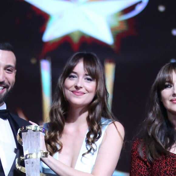 Nidhal Saadi (prix d'interprétation masculine), Dakota Johnson, Monica Bellucci lors de la cérémonie de clôture du 17ème festival du film de Marrakech (FIFM 2018) le 8 décembre 2018. © Denis Guignebourg / Bestimage