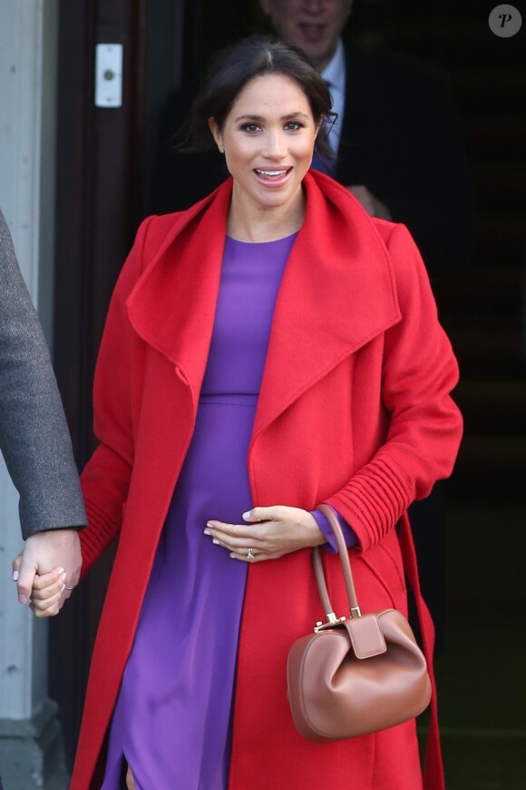 Le prince Harry, duc de Sussex, et Meghan Markle, duchesse de Sussex, enceinte, lors d'une visite à Birkenhead le 14 janvier 2019.