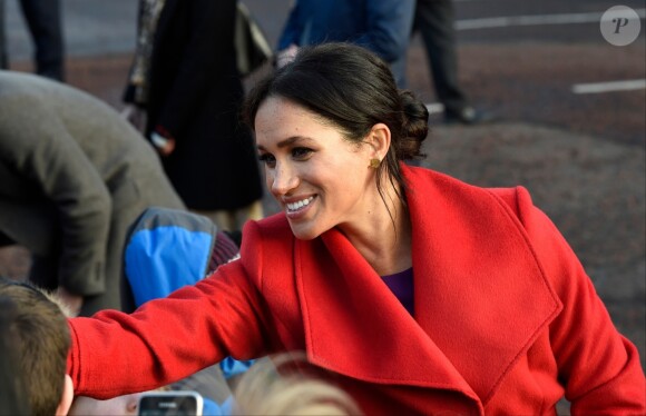 Le prince Harry, duc de Sussex, et Meghan Markle, duchesse de Sussex, enceinte, lors d'une visite à Birkenhead le 14 janvier 2019.
