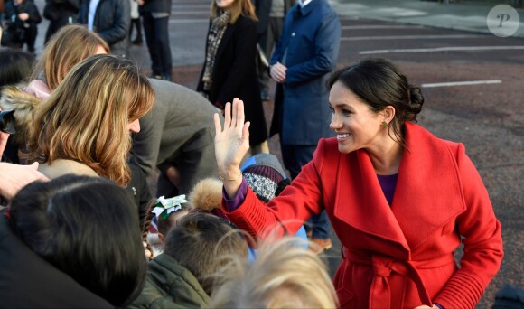 Le prince Harry, duc de Sussex, et Meghan Markle, duchesse de Sussex, enceinte, lors d'une visite à Birkenhead le 14 janvier 2019.