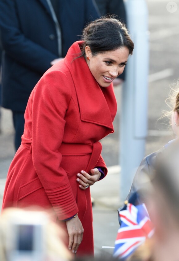 Le prince Harry, duc de Sussex, et Meghan Markle, duchesse de Sussex, enceinte, lors d'une visite à Birkenhead le 14 janvier 2019.