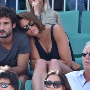 Laure Manaudou et son compagnon Jérémy Frérot (du groupe Fréro Delavega) dans les tribunes lors de la finale des Internationaux de tennis de Roland-Garros à Paris, le 7 juin 2015.07/06/2015 - Paris