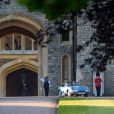 Le prince Harry, duc de Sussex, et Meghan Markle, duchesse de Sussex, habillée d'une robe Stella McCartney et portant une bague sertie d'une aigue-marine ayant appartenu à Lady Diana, ont quitté le château de Windsor après la réception offerte par Elizabeth II pour rejoindre à bord d'une Jaguar E-Type Concept Zero immatriculée "190518" Frogmore House où avait lieu la réception de leur mariage, le 19 mai 2018.