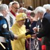 La reine Elizabeth II, accompagnée par la princesse Eugenie d'York, honorait la tradition du Royal Maundy en la chapelle St George au château de Windsor le 18 avril 2019. La souveraine y a remis des bourses (photo) contenant des pièces de monnaie à 93 bénéficiaires, soit autant que son âge (93 ans au 21 avril 2019).