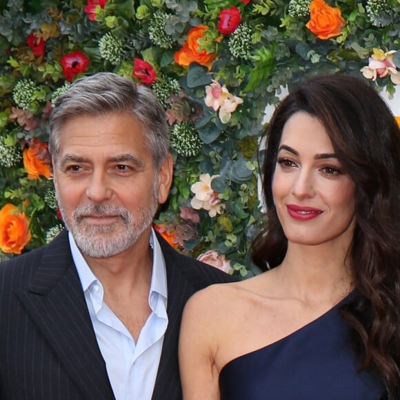 George Clooney et sa femme Amal arrivent à l'événement "Postcode Lottery Charity Gala" au McEwan hall à Edimbourg le 14 mars 2019.