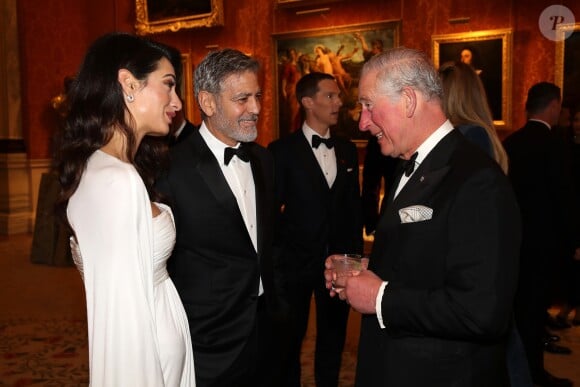 George Clooney et sa femme Amal Clooney avec le prince Charles - Dîner "The Princes Trust" au Buckingham Palace à Londres, le 12 mars 2019.