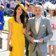 George Clooney et sa femme Amal arrivent à la chapelle S. George pour le mariage du prince Harry et de Meghan Markle au château de Windsor, Royaume Uni, le 19 mai 2018.