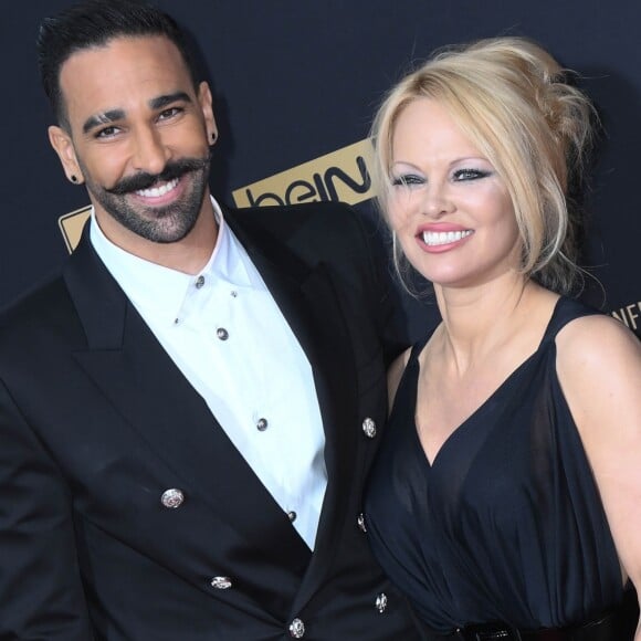 Adil Rami et sa compagne Pamela Anderson au photocall de la 28ème cérémonie des trophées UNFP (Union nationale des footballeurs professionnels) au Pavillon d'Armenonville à Paris, France, le 19 mai 2019. © Coadic Guirec/Bestimage