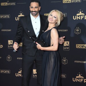 Adil Rami et sa compagne Pamela Anderson au photocall de la 28ème cérémonie des trophées UNFP (Union nationale des footballeurs professionnels) au Pavillon d'Armenonville à Paris, France, le 19 mai 2019. © Coadic Guirec/Bestimage