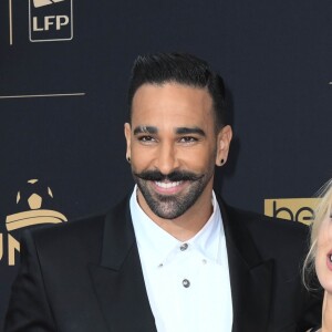 Adil Rami et sa compagne Pamela Anderson au photocall de la 28ème cérémonie des trophées UNFP (Union nationale des footballeurs professionnels) au Pavillon d'Armenonville à Paris, France, le 19 mai 2019. © Coadic Guirec/Bestimage