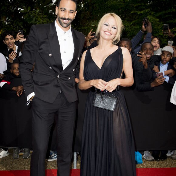 Adil Rami et sa compagne Pamela Anderson arrivent à la 28ème cérémonie des trophées UNFP (Union nationale des footballeurs professionnels) au Pavillon d'Armenonville à Paris, France, le 19 mai 2019.  Adil Rami and Pamela Anderson arrive at the 28th edition of the UNFP (French National Professional Football players Union) trophy ceremony at Pavillon d'Armenonville, in Paris, France, on May 19, 2019.19/05/2019 - Paris