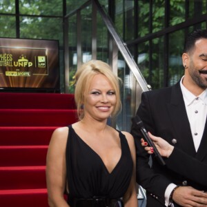 Adil Rami et sa compagne Pamela Anderson arrivent à la 28ème cérémonie des trophées UNFP (Union nationale des footballeurs professionnels) au Pavillon d'Armenonville à Paris, France, le 19 mai 2019.  Adil Rami and Pamela Anderson arrive at the 28th edition of the UNFP (French National Professional Football players Union) trophy ceremony at Pavillon d'Armenonville, in Paris, France, on May 19, 2019.19/05/2019 - Paris