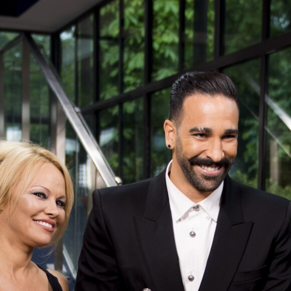 Adil Rami et sa compagne Pamela Anderson arrivent à la 28ème cérémonie des trophées UNFP (Union nationale des footballeurs professionnels) au Pavillon d'Armenonville à Paris, France, le 19 mai 2019.  Adil Rami and Pamela Anderson arrive at the 28th edition of the UNFP (French National Professional Football players Union) trophy ceremony at Pavillon d'Armenonville, in Paris, France, on May 19, 2019.19/05/2019 - Paris