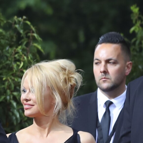 Adil Rami et sa compagne Pamela Anderson arrivent à la 28ème cérémonie des trophées UNFP (Union nationale des footballeurs professionnels) au Pavillon d'Armenonville à Paris, France, le 19 mai 2019.  Adil Rami and Pamela Anderson arrive at the 28th edition of the UNFP (French National Professional Football players Union) trophy ceremony at Pavillon d'Armenonville, in Paris, France, on May 19, 2019.19/05/2019 - Paris