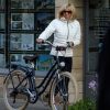 La première dame Brigitte Macron sort de chez elle à vélo, Le Touquet, France, le 25 mai 2019 la veille des élections européennes. © Stephane Lemouton / Bestimage