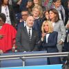 Le président de la République Emmanuel Macron et la première dame Brigitte Macron - People dans les tribunes du parc des Princes pour l'ouverture de la coupe du monde féminine de football 2019 (Mondial), opposant la France à la Corée du Sud. Paris le 7 juin 2019 © Pierre Perusseau / Bestimage