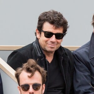 Patrick Bruel assiste à la demi-finale simple messieurs Djokovic - Thiem lors des internationaux de France de tennis de Roland Garros à Paris, France, le 8 juin 2019.