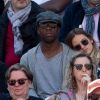 Sylvain Wiltord et sa compagne dans les tribunes des internationaux de France de tennis de Roland Garros à Paris, France, le 8 juin 2019. © Jacovides / Moreau/Bestimage