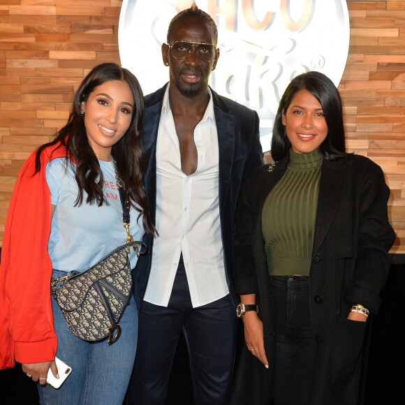 Exclusif - Mamadou Sakho, sa femme Majda et Ayem Nour lors de l'ouverture d'un TacoShake sur les Champs-Elysées à Paris, France, le 10 juin 2019. © Veeren/Bestimage