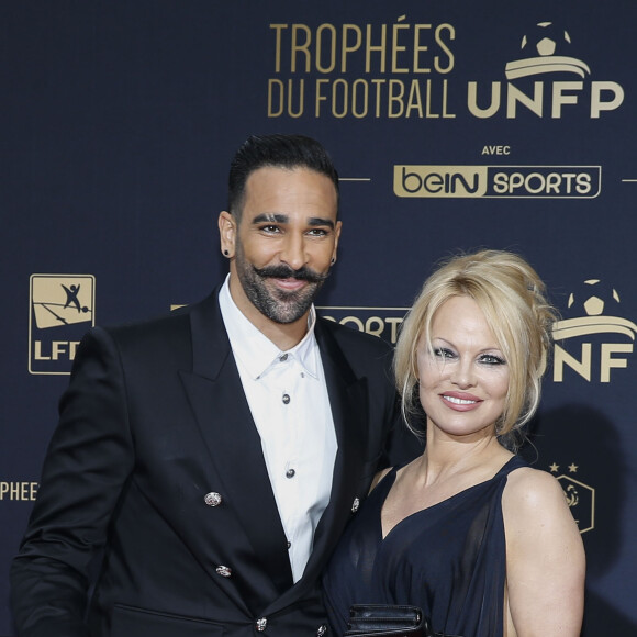 Adil Rami et Pamela Anderson au photocall de la 28ème cérémonie des trophées UNFP (Union nationale des footballeurs professionnels) au Pavillon d'Armenonville à Paris, France, le 19 mai 2019.