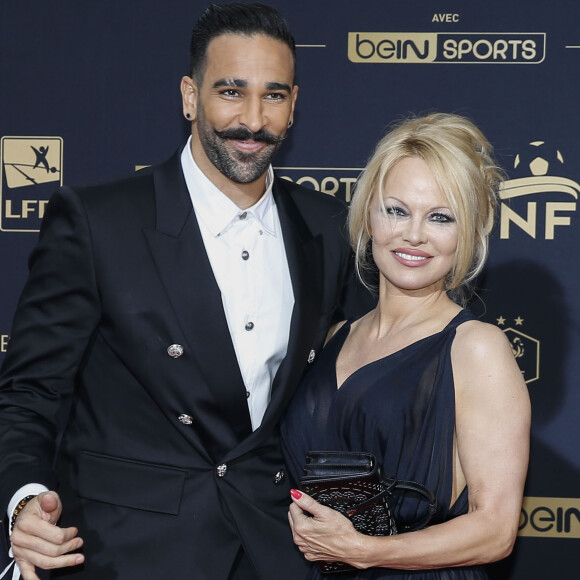 Adil Rami et Pamela Anderson au photocall de la 28ème cérémonie des trophées UNFP (Union nationale des footballeurs professionnels) au Pavillon d'Armenonville à Paris, France, le 19 mai 2019.