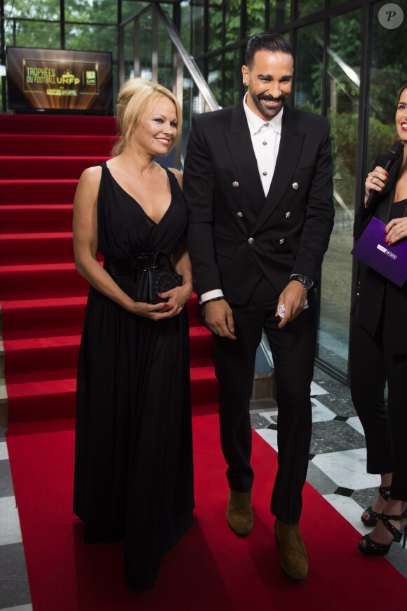 Adil Rami et Pamela Anderson arrivent à la 28ème cérémonie des trophées UNFP (Union nationale des footballeurs professionnels) au Pavillon d'Armenonville à Paris, France, le 19 mai 2019.