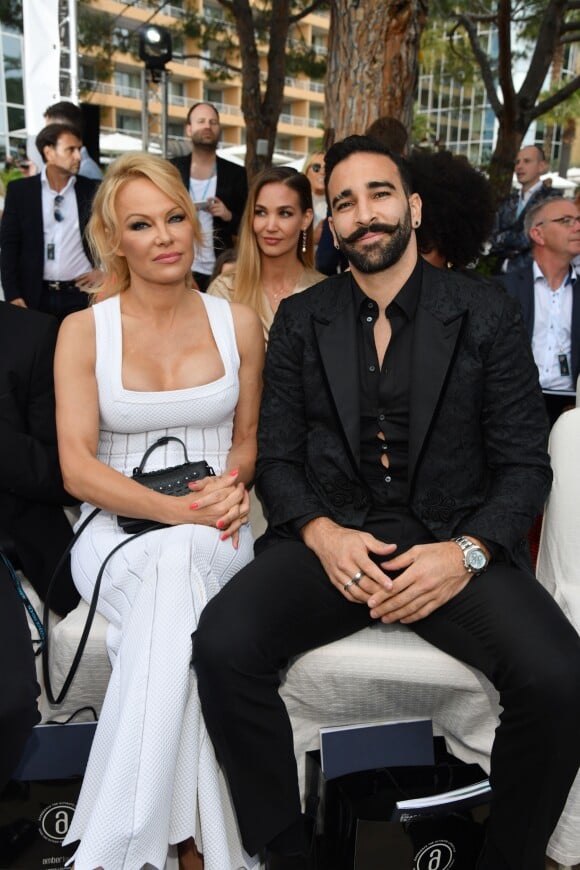 Pamela Anderson et Adil Rami lors de la soirée Amber Lounge Monaco 2019 au profit de la fondation de Jackie Stewart "Race Against Dementia" à l'hôtel Méridien Beach Plaza à Monaco, le 24 mai 2019. © Bruno Bebert / Bestimage