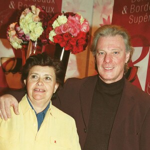 Herbert Léonard et sa femme Cléo au baptême du millésime Bordeaux, au Pavillon Gabriel, à Paris, le 18 mars 2002.