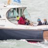 Michael Middleton, le prince George de Cambridge, Carole Middleton - Les enfants du duc et de la duchesse de Cambridge regardent d'un bateau la régate King's Cup le 8 août 2019.