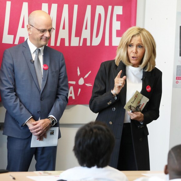 Jean-Michel Blanquer, ministre de l'éducation nationale, Brigitte Macron lors de la dictée d'ELA - Dictée d'ELA lors de sa 16e édition au Collège Suzanne Lacore, à Paris, le 14 octobre 2019. Cette dictée est le lancement officiel de la campagne "Mets Tes Baskets et bats la maladie" à l'école. ©Dominique Jacovides/Bestimage