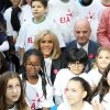 Léonie, âgée de 14 ans (T-shirt bleu ELA), Brigitte Macron, Jean-Michel Blanquer, ministre de l'éducation nationale - Dictée d'ELA lors de sa 16e édition au Collège Suzanne Lacore, à Paris, le 14 octobre 2019. Cette dictée est le lancement officiel de la campagne "Mets Tes Baskets et bats la maladie" à l'école. ©Dominique Jacovides/Bestimage