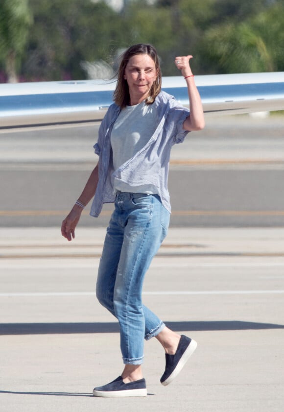 Harrison Ford, sa femme Calista Flockhart et leur fils Liam à leur arrivée en jet privé à l'aéroport de Los Angeles. le 4 juillet