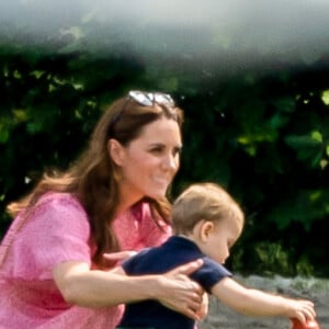 Catherine (Kate) Middleton, duchesse de Cambridge et le prince Louis de Cambridge lors d'un match de polo de bienfaisance King Power Royal Charity Polo Day à Wokinghan, comté de Berkshire, Royaume Uni, le 10 juillet 2019.