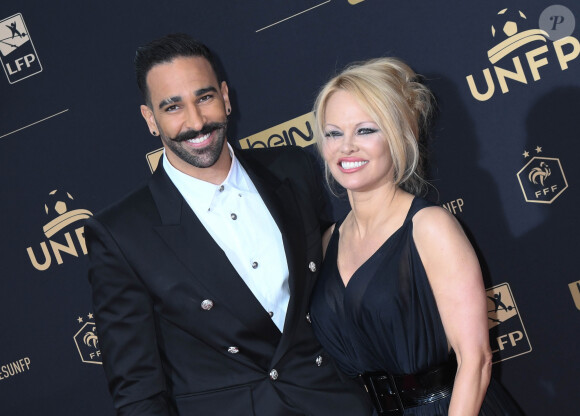 Adil Rami et sa compagne Pamela Anderson au photocall de la 28ème cérémonie des trophées UNFP (Union nationale des footballeurs professionnels) au Pavillon d'Armenonville à Paris, France, le 19 mai 2019. © Coadic Guirec/Bestimage