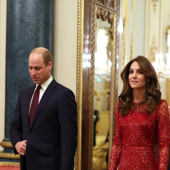 Le prince William, duc de Cambridge, et Kate Middleton, duchesse de Cambridge, accueillent les invités de la réception organisée pour le début du "Sommet Grande-Bretagne-Afrique sur les investissements" à Buckingham Palace, le 20 janvier 2020.