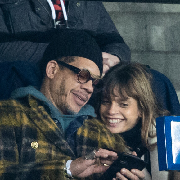 Exclusif - Joey Starr (JoeyStarr) avec une mystérieuse inconnue dans les tribunes lors du match de Ligue 1 opposant le Paris Saint-Germain à l'AS Monaco au Parc des Princes à Paris, France, le 12 janvier 2020.